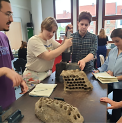 Participants measure the permeability of lava flow and hyaloclastite blocks with the TinyPerm